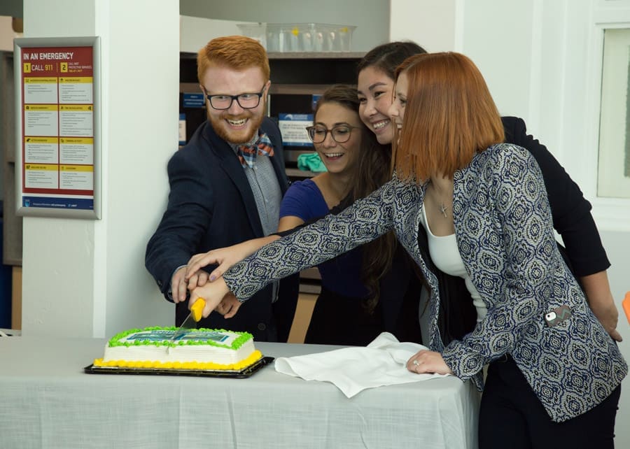 Assorted executives from NAITSA cut cake at NAITrium grand opening