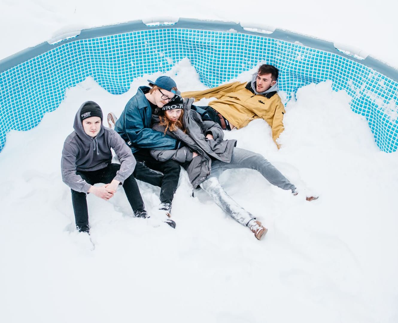 Squids Edmonton Band Guys in a Pool Full of Snow