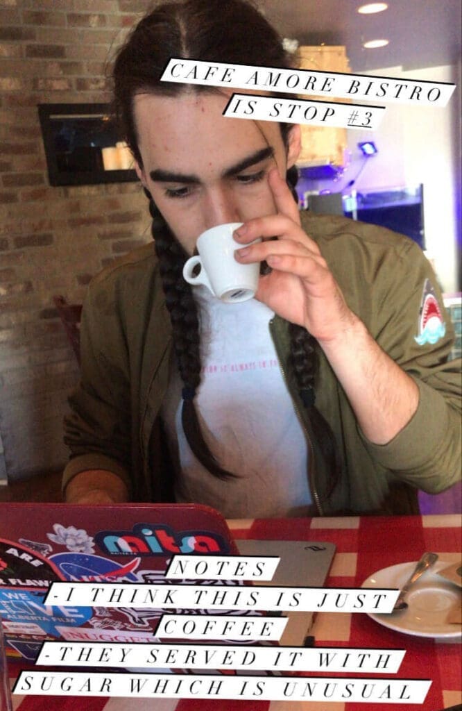 man sips a cup of espresso in coffee shop