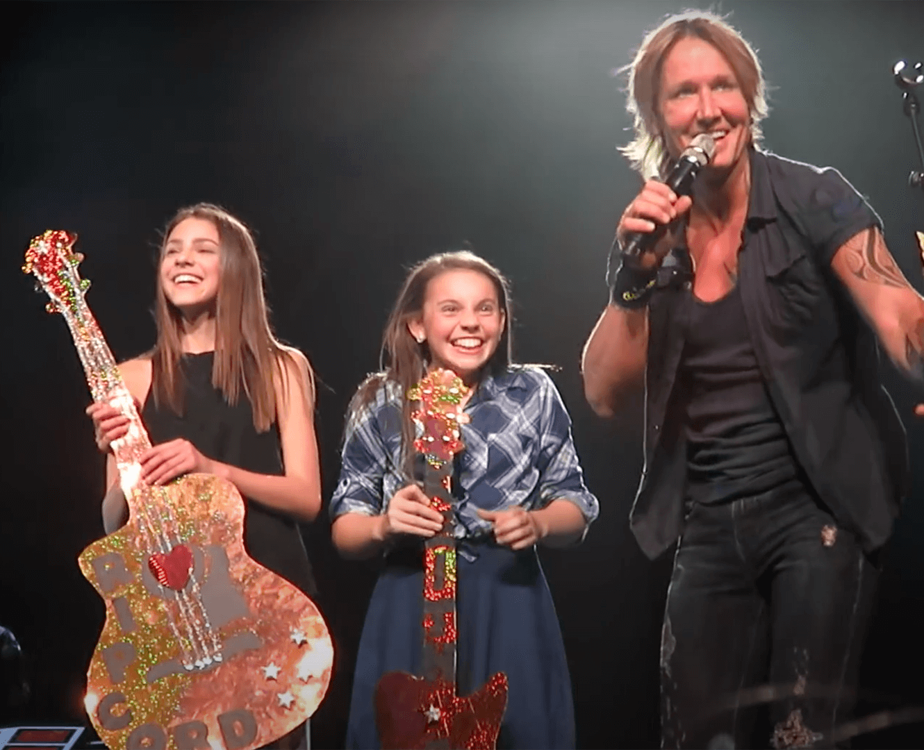 Local musician rises as country music star Keith Urban pulls up local singer Hailey Benedict on stage to perform