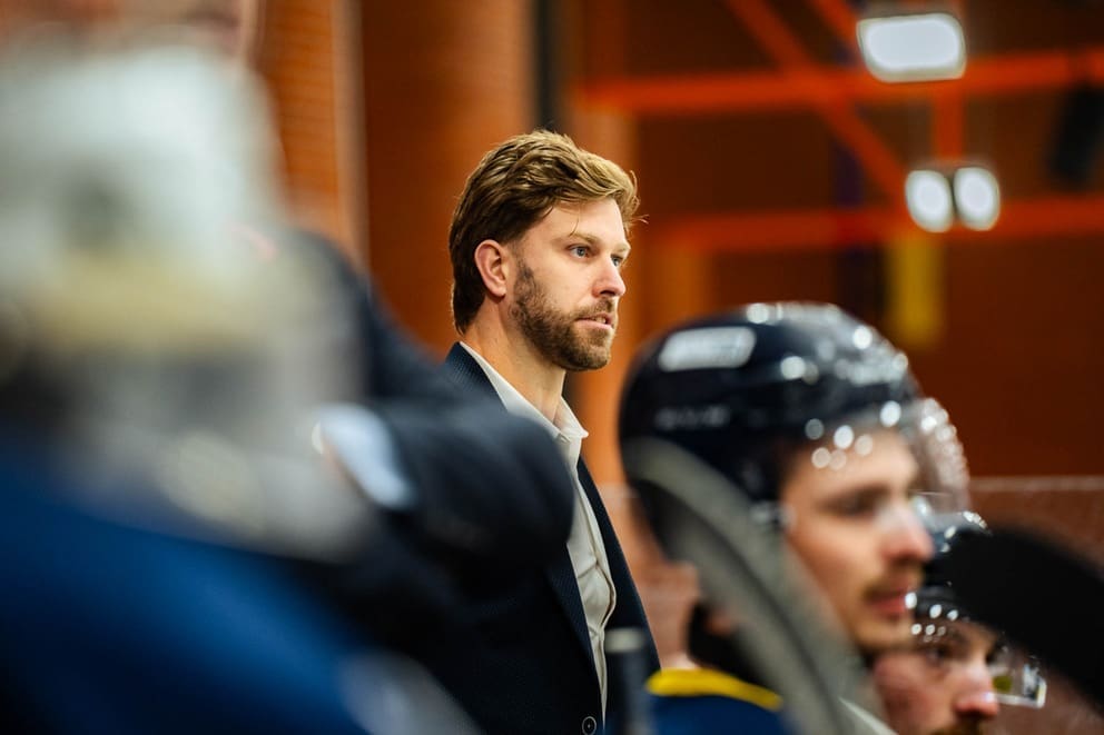 A photograph of Scott Fellnermayr looking ahead with his team blurred in the foreground