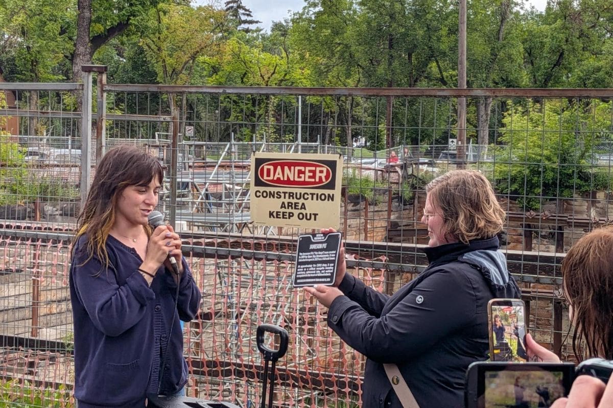 Pit Tour Decleration People gathered around Jameson Pit, celebrating and honoring it with a speech as somebody holds a plaque with the title 'Jameson Pit'