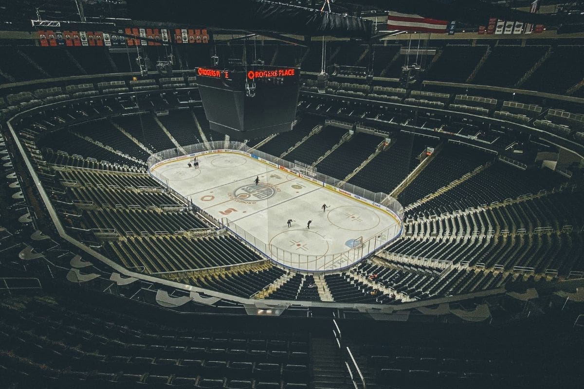 Fermenton photograph of an empty Rogers stadium, the lights are low while the rink is bright